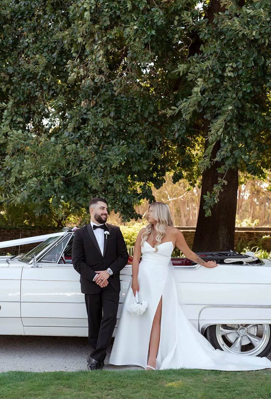 Wedding couple with a vintage car Wedding couple with a vintage car after their ceremony with John Edney