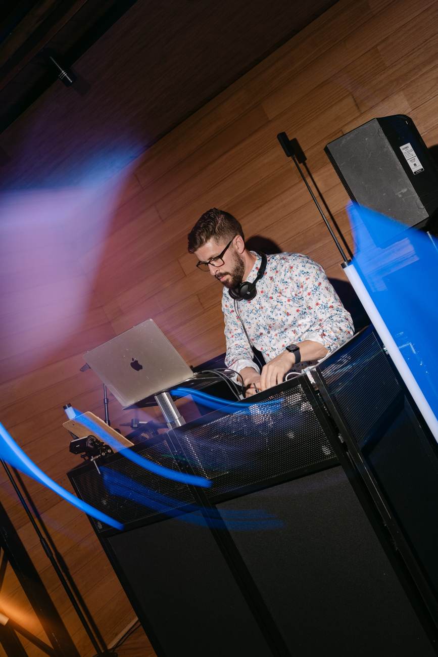John Edney mixing live on his DJ setup with premium lighting