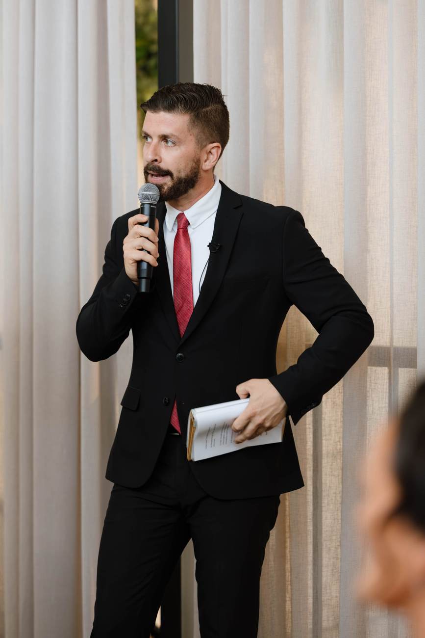 John Edney, wedding MC John Edney on the microphone as wedding MC during the formalities