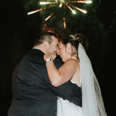 Wedding Couple Smiling With Fireworks