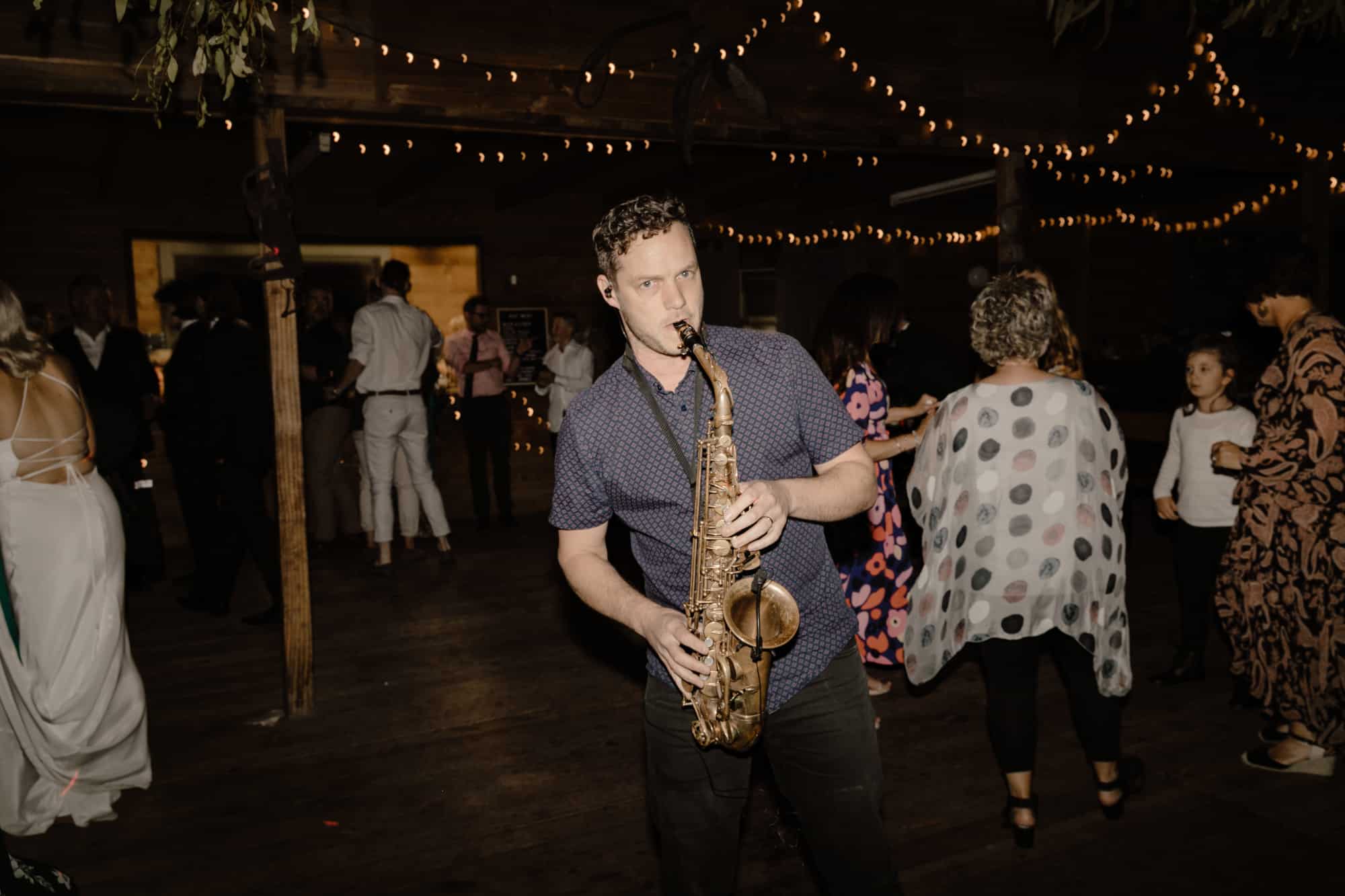 Jess & Kaleb Wedding Performer Playing Saxophone